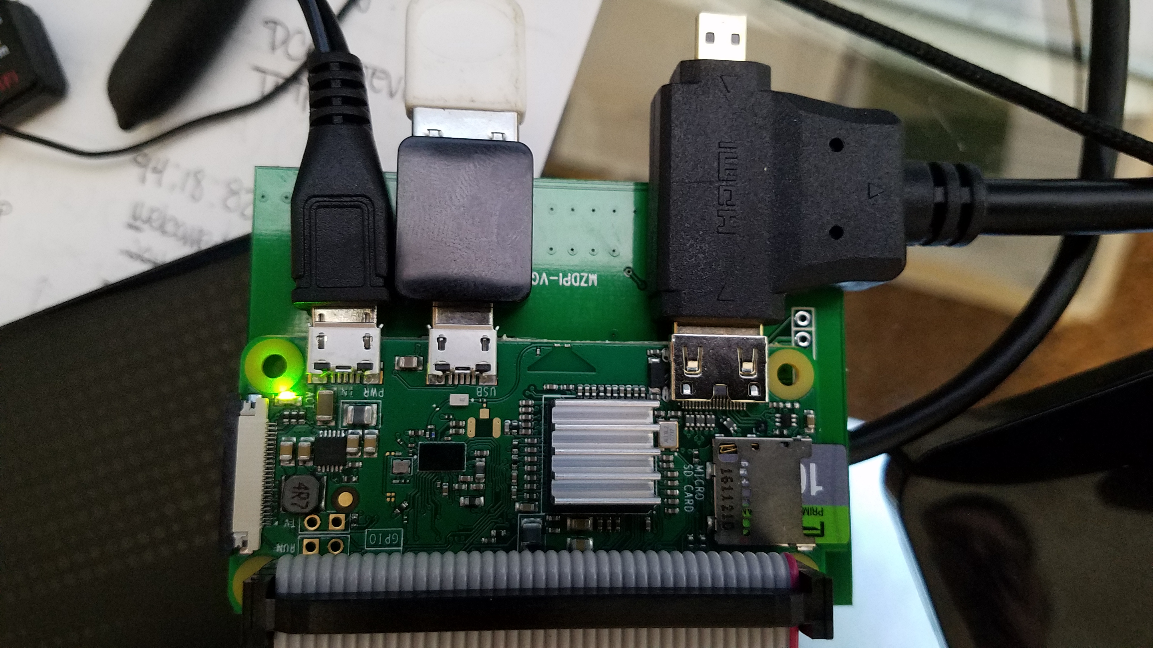 Raspberry Pi Zero W with GPIO header, TFT screen, USB and HDMI adapters connected